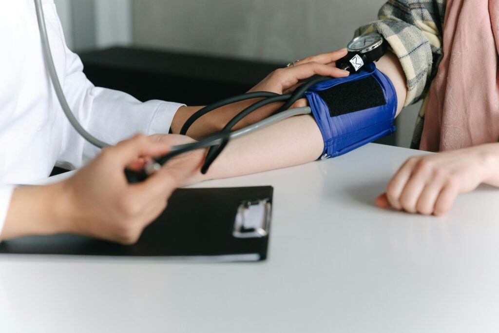 A woman getting her blood pressure tested.